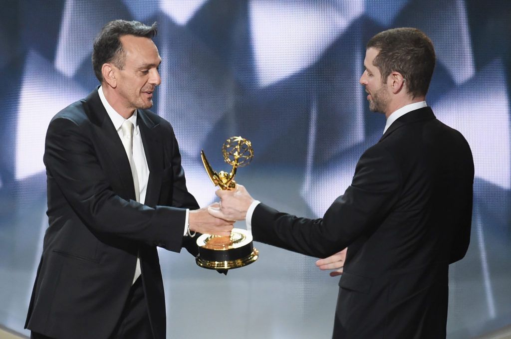 Writer/producer D.B. Weiss (R) accepts Outstanding Writing for a Drama Series for 'Game of Thrones' episode 'Battle of the Bastards' from actor Hank Azaria (L) onstage during the 68th Annual Primetime Emmy Awards at Microsoft Theater on September 18, 2016 in Los Angeles, California.  (Photo by Kevin Winter/Getty Images)