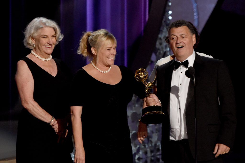 Producers Sue Vertue (C) and Steven Moffat (R) accept Outstanding Television Movie for 'Sherlock: The Abominable Bride' onstage during the 68th Emmy Awards show on September 18, 2016 at the Microsoft Theatre in downtown Los Angeles.  / AFP / Valerie MACON        (Photo  VALERIE MACON/AFP/Getty Images)