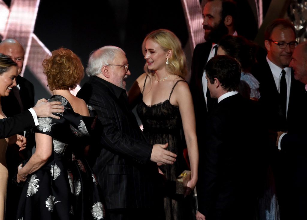 Writer George R.R. Martin and actress Sophie Turner accept Outstanding Drama Series for 'Game of Thrones' onstage during the 68th Annual Primetime Emmy Awards at Microsoft Theater on September 18, 2016 in Los Angeles, California.  (Photo by Kevin Winter/Getty Images)
