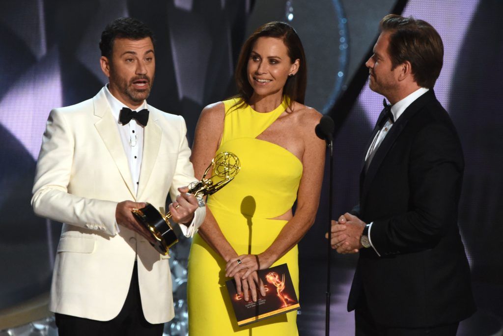 Host Jimmy Kimmel (L), actors Minnie Driver (C), and Michael Weatherly speak onstage  during the 68th Emmy Awards show on September 18, 2016 at the Microsoft Theatre in downtown Los Angeles.  / AFP / Valerie MACON        (Photo VALERIE MACON/AFP/Getty Images)