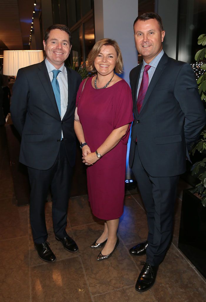 Minister Paschal Donohoe and wife Justine Donohoe with Nicky Logue at Dublin's All Ireland Football celebration dinner at the Gibson Hotel, Point Village Dublin (Picture: Brian McEvoy).