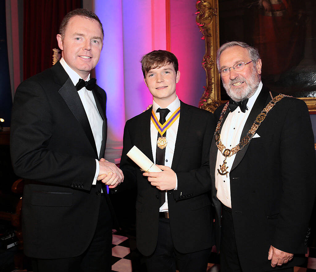 Niall Gaffney -Chief Executive Iput and Grand Master Douglas T Grey congratulate Christopher Moriarty-Pearson overall winner at The Irish Freemason's Young Musician of the Year Competition 2016 at Freemason Hall, Dublin (Picture: Brian McEvoy)