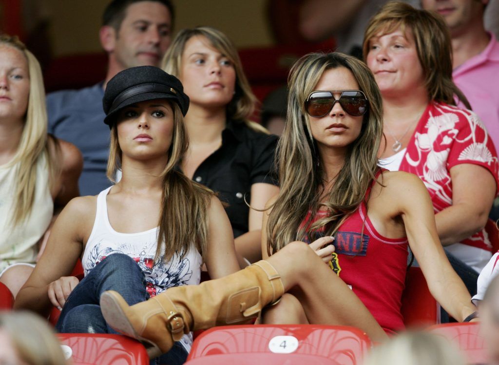 Cheryl and Victoria Beckham attend the FIFA World Cup Germany 2006 Group B match between England and Trinidad and Tobago at the Frankenstadion on June 15, 2006 in Nuremberg, Germany. (Photo by Ross Kinnaird/Getty Images)