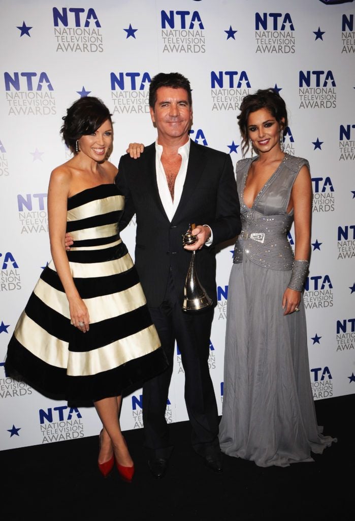 Danni Minogue, Simon Cowell and Cheryl appear with their award for Most Popular Talent Show at the National Television Awards held at O2 Arena on January 20, 2010 in London, England. (Photo by Ian Gavan/Getty Images)