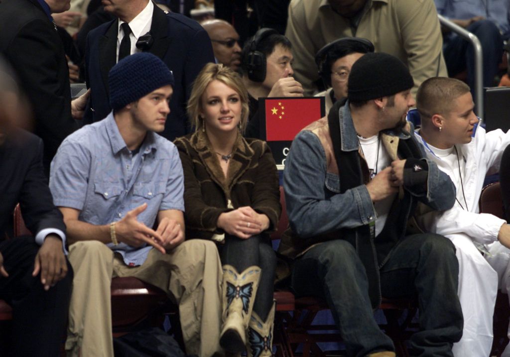 Justin Timberlake, Britney Spears, and Chris Kirkpatrick at the 'NBA All-Star Game' at the First Union Center in Philadelphia, Pa. 10th february 2002. Photo by Scott Gries/NBAE/Getty Images