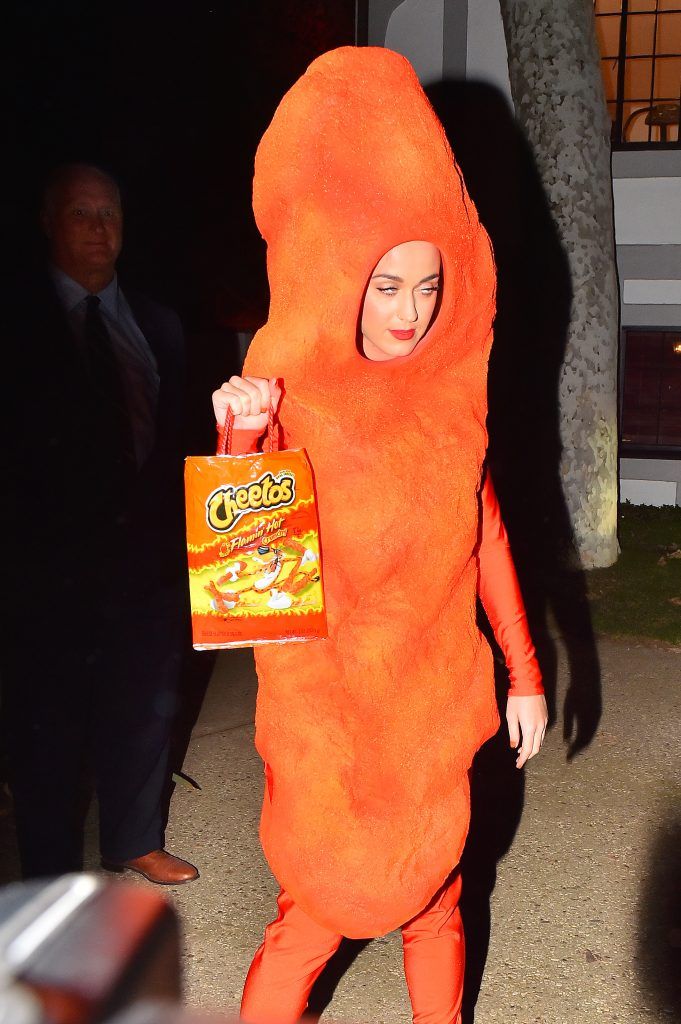 Katy Perry poses in a Cheeto costume at Kate Hudson's halloween party
on 30 Oct 2014 (Photo by WENN.com)