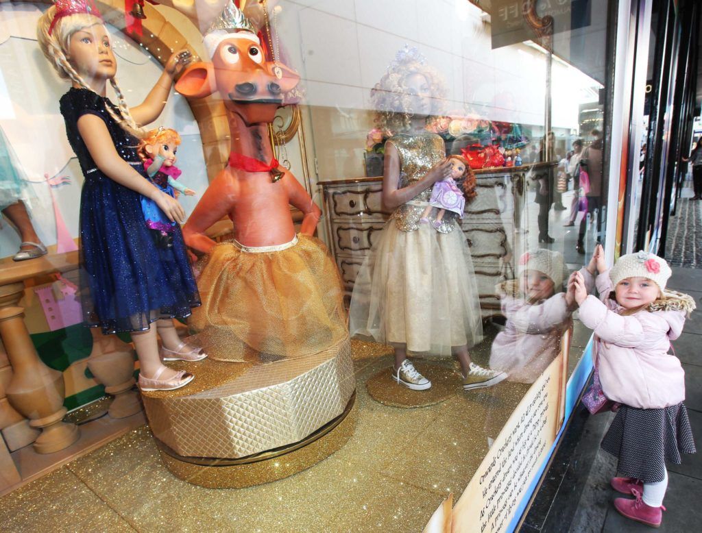 Pictured is Mia Geoghan (3) as Arnotts unveiled their iconic Christmas Windows, which reveal Santa's newest reindeer, Crackers, and also a pop up Tayto Crispmas Workshop. Photograph: Leon Farrell / Photocall Ireland