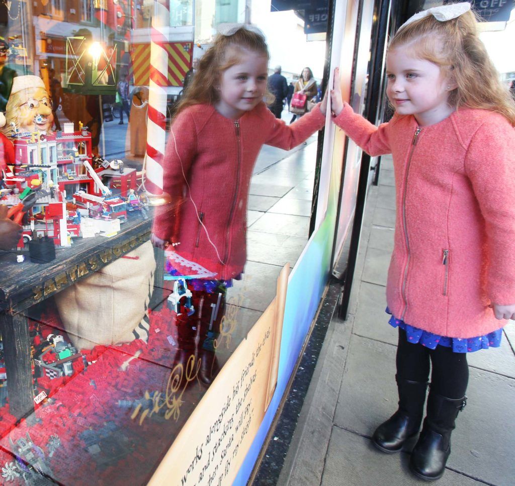 Pictured is Chloe Dalton (7) as Arnotts unveiled their iconic Christmas Windows, which reveal Santa's newest reindeer, Crackers, and also a pop up Tayto Crispmas Workshop. Photograph: Leon Farrell / Photocall Ireland
