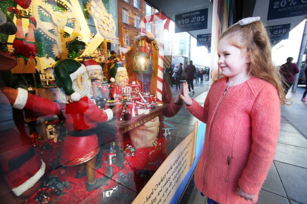 Pictured is Chloe Dalton (7) as Arnotts unveiled their iconic Christmas Windows, which reveal Santa's newest reindeer, Crackers, and also a pop up Tayto Crispmas Workshop. Photograph: Leon Farrell / Photocall Ireland