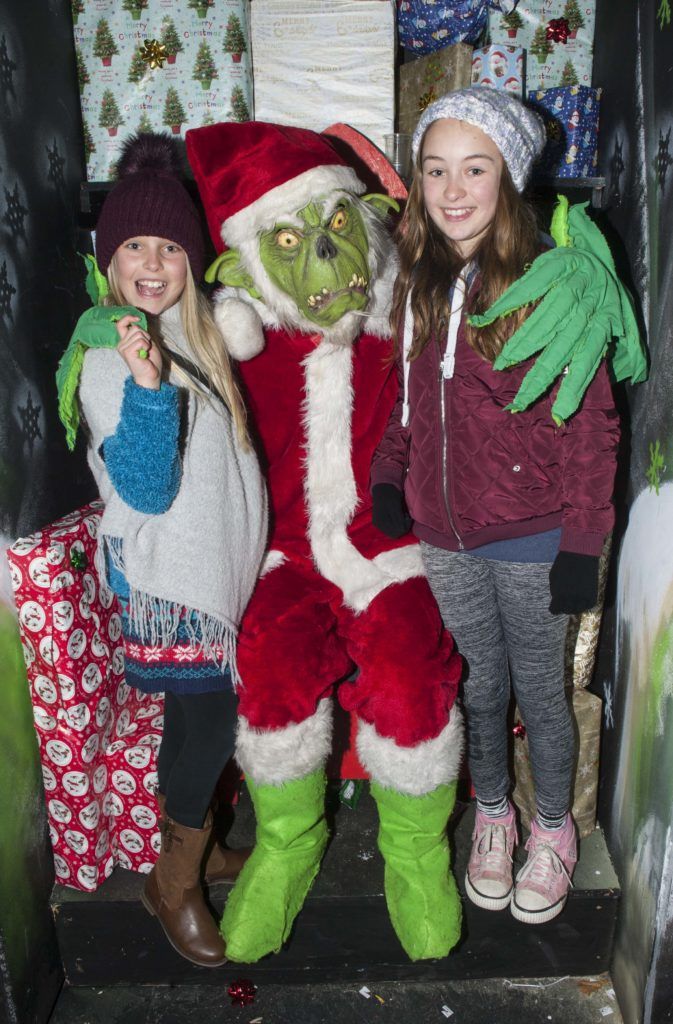 Olivia Garnett (age 10) and Caitlin Garnett (age 12) meet the Grinch at the opening weekend of Winterval Festival in Waterford, Ireland's biggest and best Christmas Festival with a sparkling programme of over 30 different events and activities. Pic Patrick O'Leary