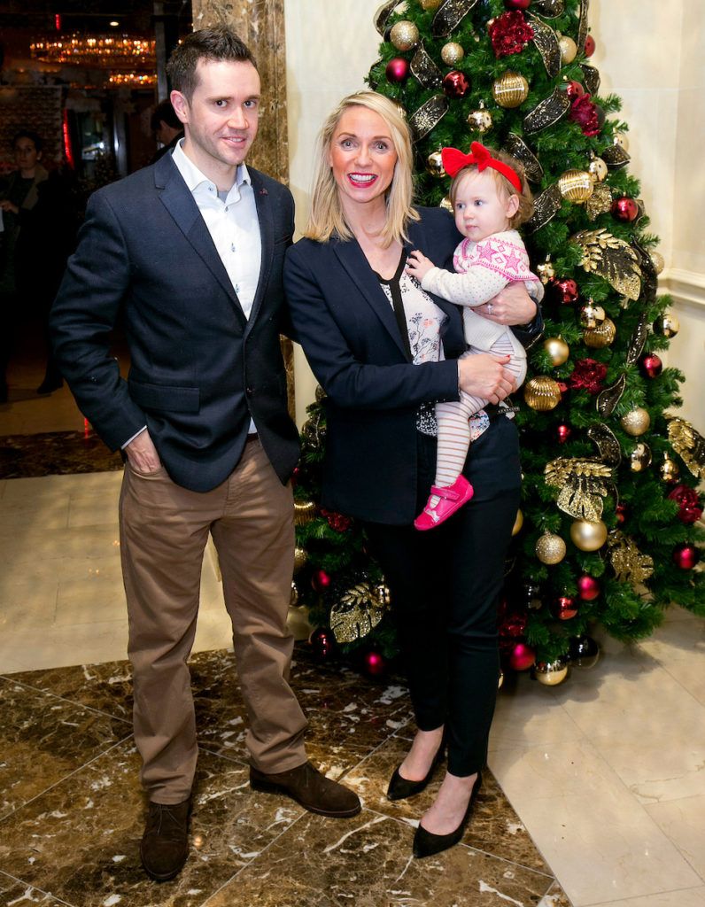 Pictured are Kieran and Katie O'Rourke with baby Lottie at the annual Shelbourne Hotel Christmas Tree Lighting Ceremony. With the stunning tree officially lit up by very special guest Ryan Tubridy. Pic: Marc O'Sullivan