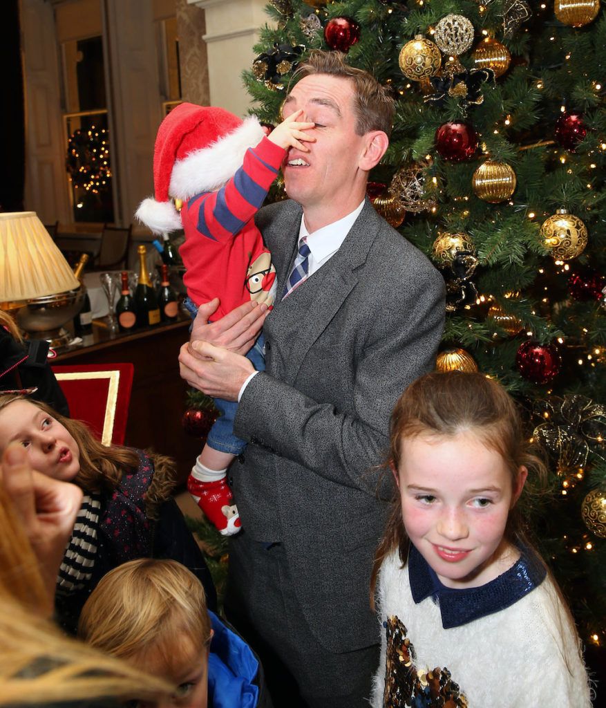 Pictured having a piece of Ryan's nose is Adam Neville aged 7 months with Ryan Tubridy at the annual Shelbourne Hotel Christmas Tree Lighting Ceremony. With the stunning tree officially lit up by very special guest Ryan Tubridy. Pic: Marc O'Sullivan