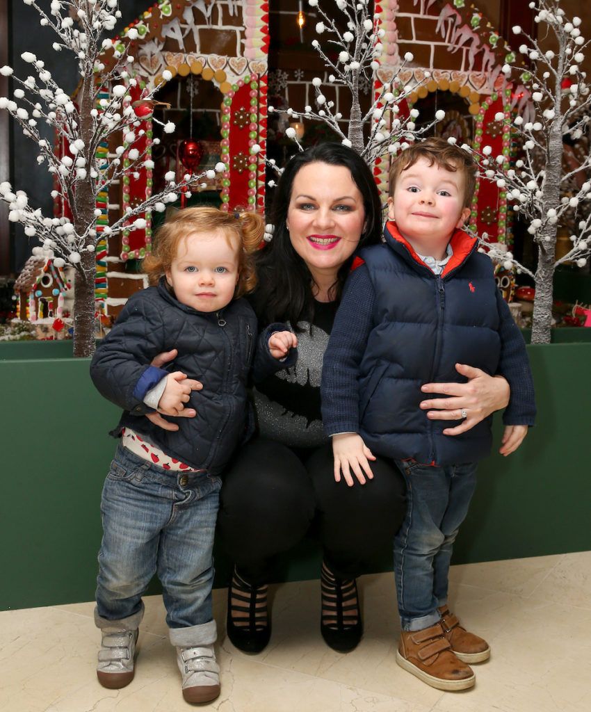 Pictured is Triona McCarthy with her children Mini Whote aged 1 and Maxi White aged 3 at the annual Shelbourne Hotel Christmas Tree Lighting Ceremony. With the stunning tree officially lit up by very special guest Ryan Tubridy. Pic: Marc O'Sullivan