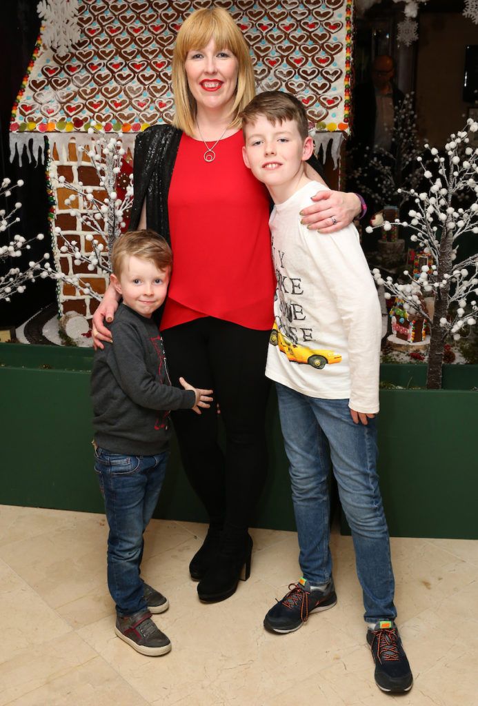 Pictured are Jamie O'Connell, Niamh Savage and Joseph O'Connell at the annual Shelbourne Hotel Christmas Tree Lighting Ceremony. With the stunning tree officially lit up by very special guest Ryan Tubridy. Pic: Marc O'Sullivan