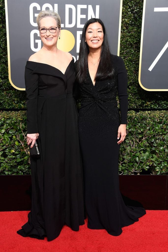 BEVERLY HILLS, CA - JANUARY 07:  Actor Meryl Streep (L) and NDWA Director Ai-jen Poo attend The 75th Annual Golden Globe Awards at The Beverly Hilton Hotel on January 7, 2018 in Beverly Hills, California.  (Photo by Frazer Harrison/Getty Images)