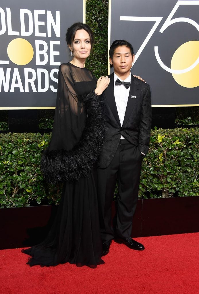 BEVERLY HILLS, CA - JANUARY 07:  Actor/director Angelina Jolie (L) and Pax Thien Jolie-Pitt attend The 75th Annual Golden Globe Awards at The Beverly Hilton Hotel on January 7, 2018 in Beverly Hills, California.  (Photo by Frazer Harrison/Getty Images)