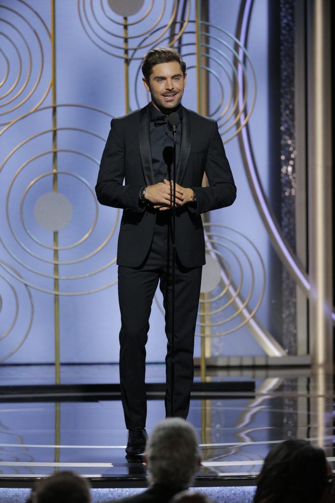 BEVERLY HILLS, CA - JANUARY 07:  In this handout photo provided by NBCUniversal,  Actor Zac Efron speaks onstage during the 75th Annual Golden Globe Awards at The Beverly Hilton Hotel on January 7, 2018 in Beverly Hills, California.  (Photo by Paul Drinkwater/NBCUniversal via Getty Images)