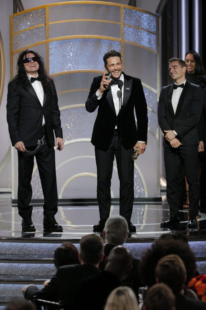 BEVERLY HILLS, CA - JANUARY 07:  In this handout photo provided by NBCUniversal,  James Franco, with Tommy Wiseau and Dave Franco,  accepts the award for Best Performance by an Actor in a Motion Picture – Musical or Comedy for  “The Disaster Artist” during the 75th Annual Golden Globe Awards at The Beverly Hilton Hotel on January 7, 2018 in Beverly Hills, California.  (Photo by Paul Drinkwater/NBCUniversal via Getty Images)