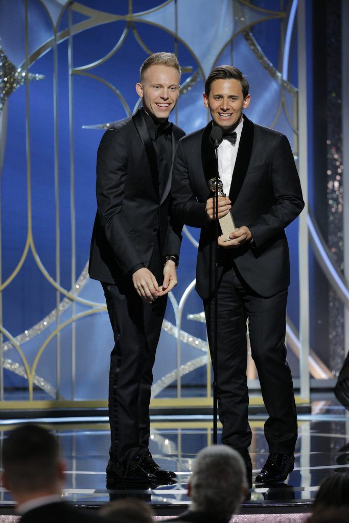 BEVERLY HILLS, CA - JANUARY 07:  In this handout photo provided by NBCUniversal, Justin Paul and  Benj Pasek accept the award for Best Original Song – Motion Picture for “This Is Me" from "The Greatest Showman"  during the 75th Annual Golden Globe Awards at The Beverly Hilton Hotel on January 7, 2018 in Beverly Hills, California.  (Photo by Paul Drinkwater/NBCUniversal via Getty Images)