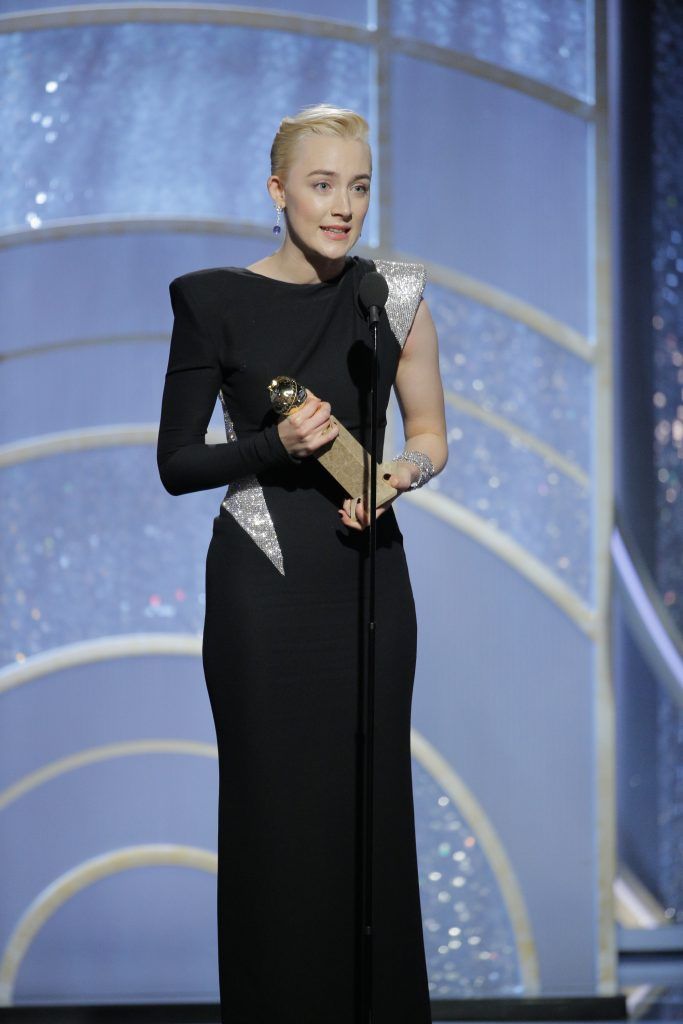 BEVERLY HILLS, CA - JANUARY 07:  In this handout photo provided by NBCUniversal,  Saoirse Ronan accepts the award for Best Performance by an Actress in a Motion Picture – Musical or Comedy for “Lady Bird” during the 75th Annual Golden Globe Awards at The Beverly Hilton Hotel on January 7, 2018 in Beverly Hills, California.  (Photo by Paul Drinkwater/NBCUniversal via Getty Images)