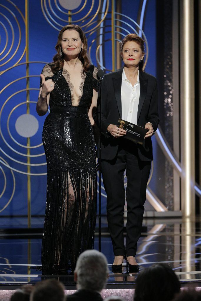 BEVERLY HILLS, CA - JANUARY 07:  In this handout photo provided by NBCUniversal,  Presenters Geena Davis and  Susan Sarandon  onstage during the 75th Annual Golden Globe Awards at The Beverly Hilton Hotel on January 7, 2018 in Beverly Hills, California.  (Photo by Paul Drinkwater/NBCUniversal via Getty Images)