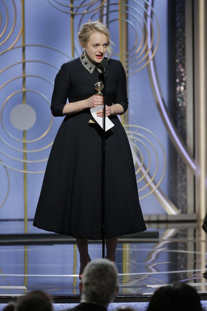 BEVERLY HILLS, CA - JANUARY 07:  In this handout photo provided by NBCUniversal, Elisabeth Moss accepts the award for Best Performance by an Actress in a Television Series – Drama for “The Handmaid’s Tale”  speaks onstage during the 75th Annual Golden Globe Awards at The Beverly Hilton Hotel on January 7, 2018 in Beverly Hills, California.  (Photo by Paul Drinkwater/NBCUniversal via Getty Images)