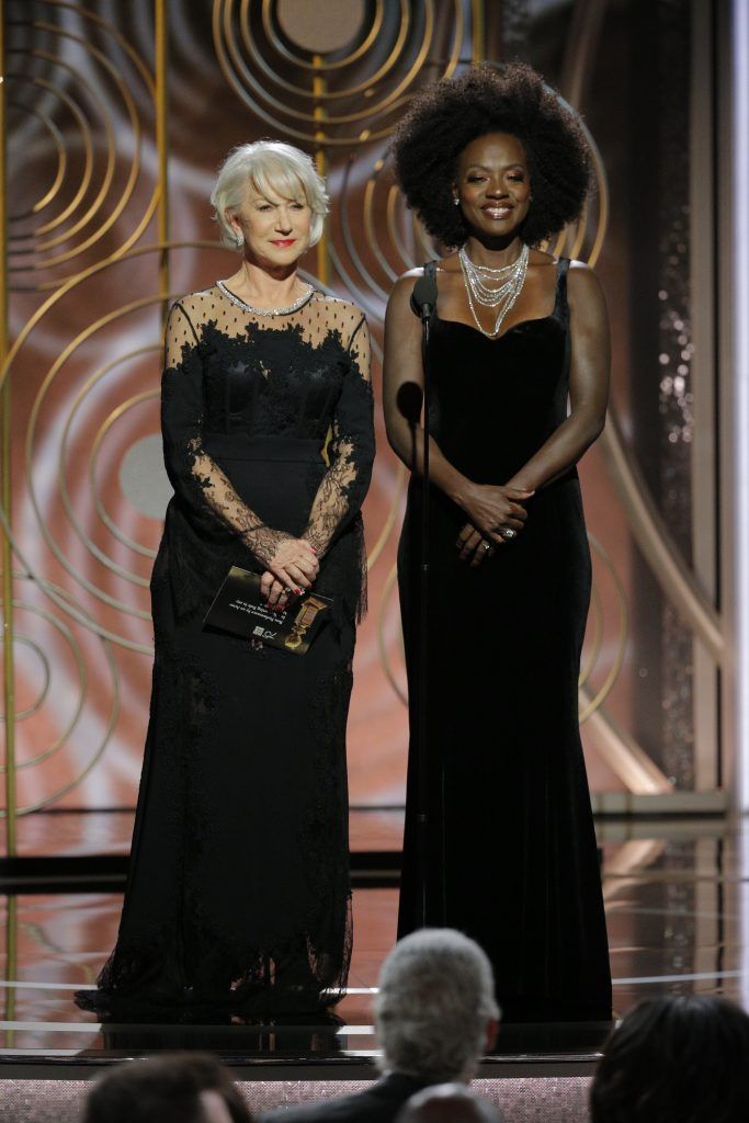 BEVERLY HILLS, CA - JANUARY 07:  In this handout photo provided by NBCUniversal,  Presenters Helen Mirren and  Viola Davis onstage during the 75th Annual Golden Globe Awards at The Beverly Hilton Hotel on January 7, 2018 in Beverly Hills, California.  (Photo by Paul Drinkwater/NBCUniversal via Getty Images)