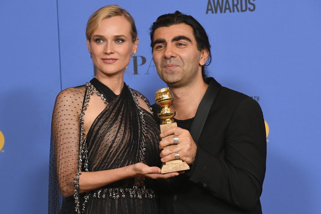 BEVERLY HILLS, CA - JANUARY 07:  Actor Diane Kruger poses with director Fatih Akin and his award for Best Motion Picture Foreign Language (Germany, France) for 'In The Fade' in the press room during The 75th Annual Golden Globe Awards at The Beverly Hilton Hotel on January 7, 2018 in Beverly Hills, California.  (Photo by Kevin Winter/Getty Images)