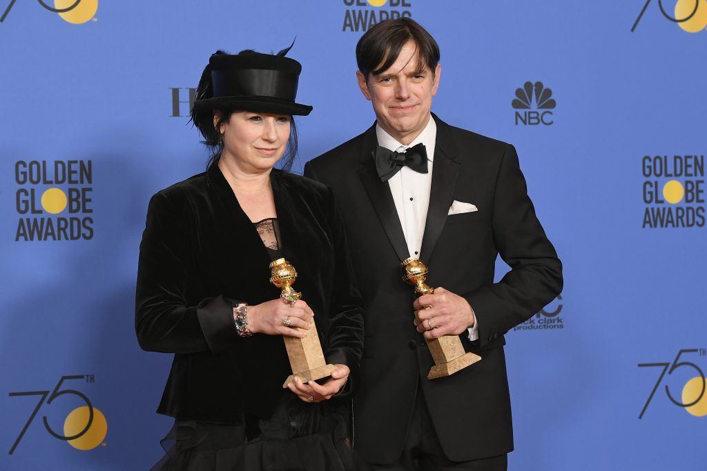 BEVERLY HILLS, CA - JANUARY 07:  Amy Sherman-Palladino and Daniel Palladino pose with the award for Best Television Series Musical or Comedy for 'The Marvelous Mrs. Maisel' in the press room during The 75th Annual Golden Globe Awards at The Beverly Hilton Hotel on January 7, 2018 in Beverly Hills, California.  (Photo by Kevin Winter/Getty Images)