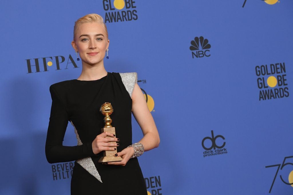 BEVERLY HILLS, CA - JANUARY 07:  Actress Saoirse Ronan poses with the award for Best Performance by an Actress in a Motion Picture Musical or Comedy in 'Lady Bird' in the press room during The 75th Annual Golden Globe Awards at The Beverly Hilton Hotel on January 7, 2018 in Beverly Hills, California.  (Photo by Kevin Winter/Getty Images)