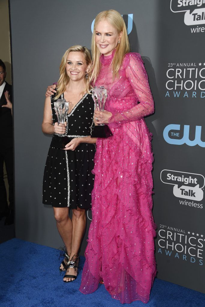 Actors Reese Witherspoon (L) and Nicole Kidman, recipients of the Best Limited Series award for 'Big Little Lies', pose in the press room during The 23rd Annual Critics' Choice Awards at Barker Hangar on January 11, 2018 in Santa Monica, California.  (Photo by Frazer Harrison/Getty Images)