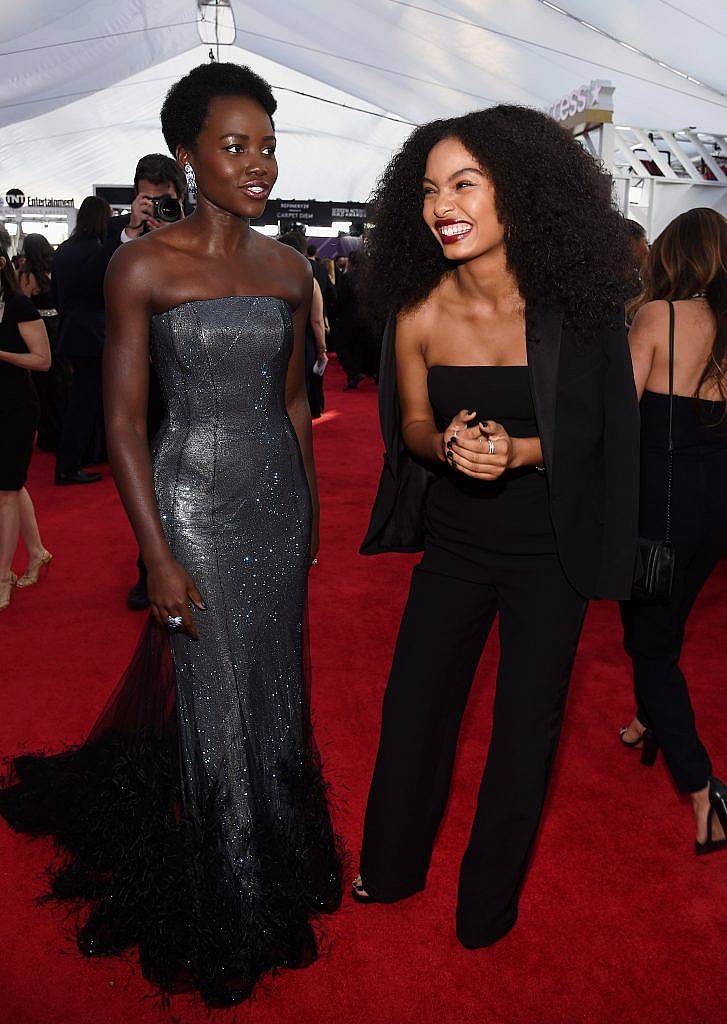 LOS ANGELES, CA - JANUARY 21:  Actors Lupita Nyong'o (L) and Yara Shahidi attend the 24th Annual Screen Actors Guild Awards at The Shrine Auditorium on January 21, 2018 in Los Angeles, California.  (Photo by Kevork Djansezian/Getty Images)