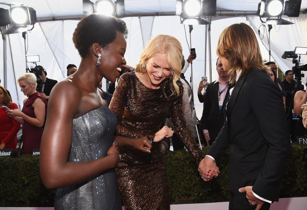 LOS ANGELES, CA - JANUARY 21: (L-R) Actors Lupita Nyong'o, Nicole Kidman, and musician Keith Urban attends the 24th Annual Screen Actors Guild Awards at The Shrine Auditorium on January 21, 2018 in Los Angeles, California.  (Photo by Kevork Djansezian/Getty Images)
