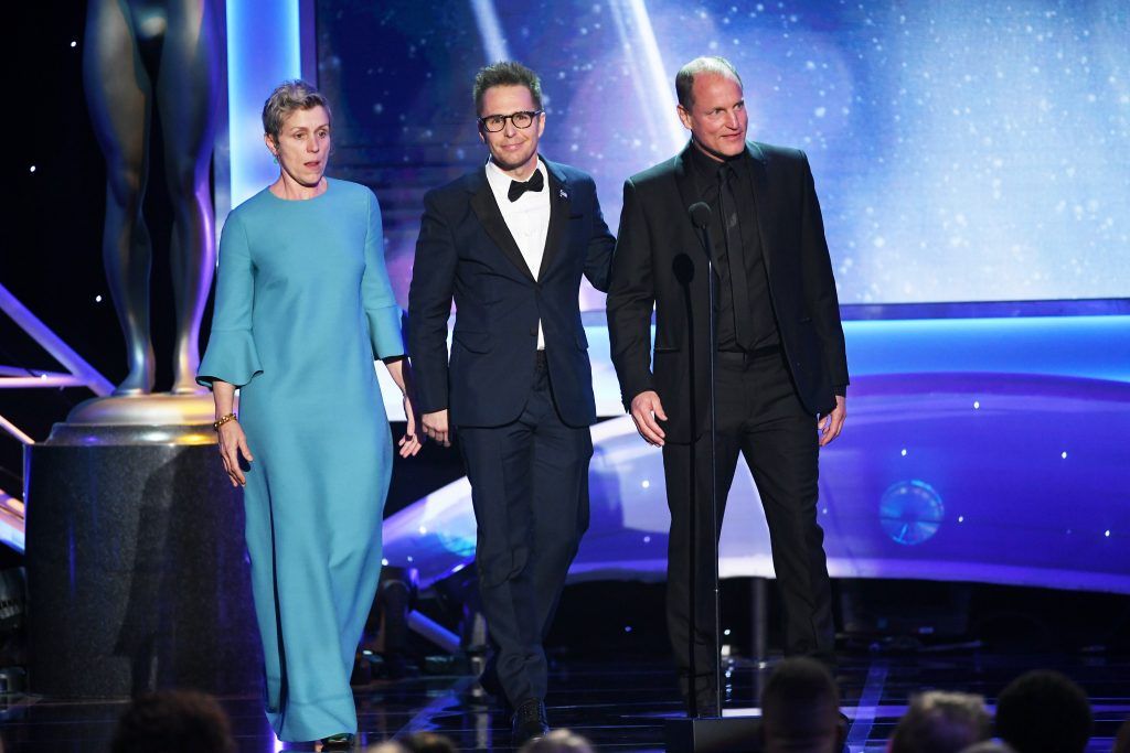 Actors Frances McDormand, Sam Rockwell, and Woody Harrelson walk onstage during the 24th Annual Screen Actors Guild Awards at The Shrine Auditorium on January 21, 2018 in Los Angeles, California. (Photo by Kevin Winter/Getty Images)