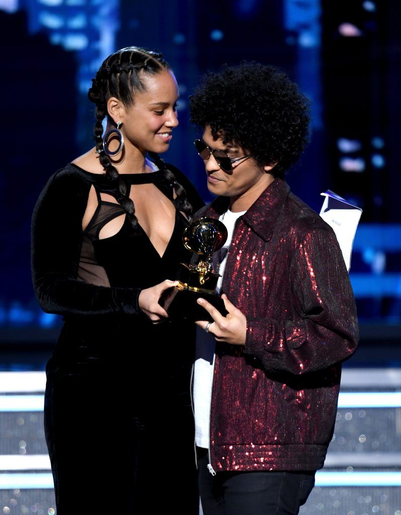 Recording artist Bruno Mars (R) accepts Record of the Year for '24K Magic' from Alicia Keys onstage during the 60th Annual GRAMMY Awards at Madison Square Garden on January 28, 2018 in New York City.  (Photo by Kevin Winter/Getty Images for NARAS)