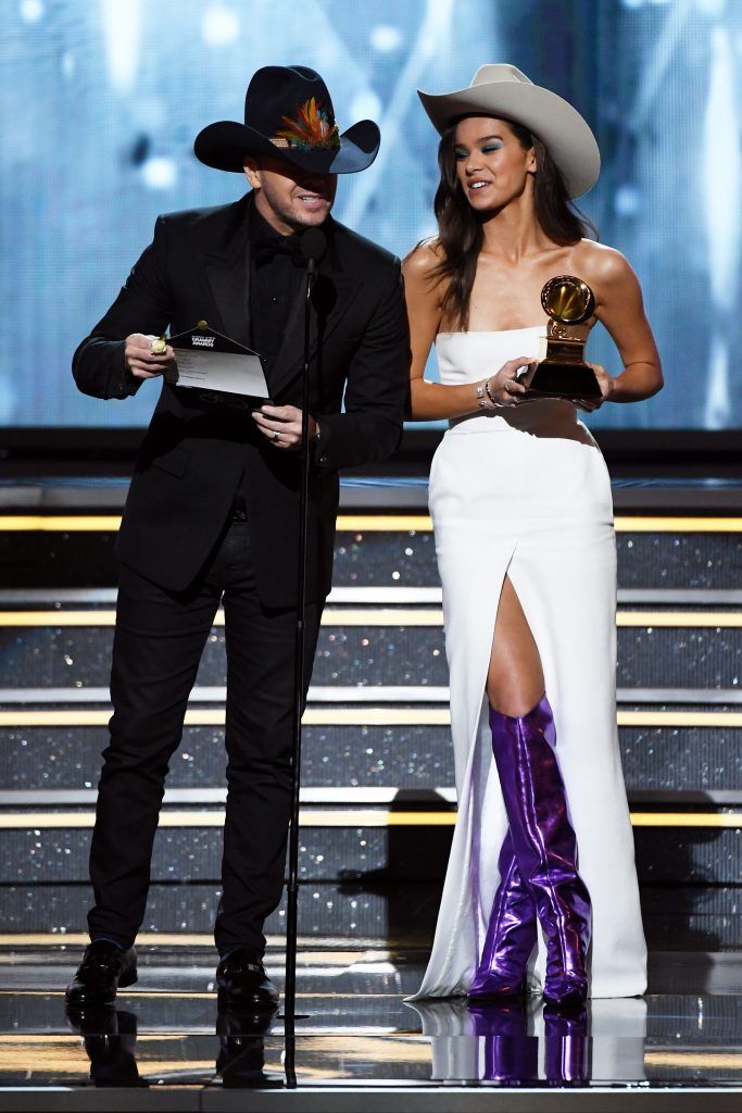 Actors/recording artists Donnie Wahlberg (L) and Hailee Steinfeld speak onstage during the 60th Annual GRAMMY Awards at Madison Square Garden on January 28, 2018 in New York City.  (Photo by Kevin Winter/Getty Images for NARAS)