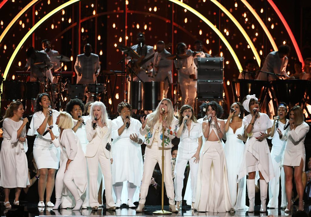 Recording artist Kesha (C) performs with (L-R) Bebe Rexha, Cyndi Lauper, Camila Cabello, Andra Day, Julia Michaels, and chorus members onstage during the 60th Annual GRAMMY Awards at Madison Square Garden on January 28, 2018 in New York City.  (Photo by Kevin Winter/Getty Images for NARAS)