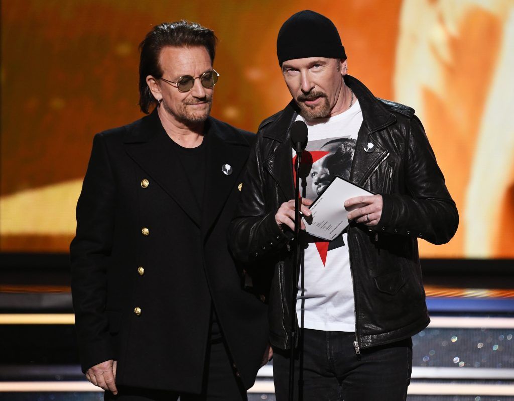 Recording artists Bono (L) and The Edge of music group U2 speak onstage during the 60th Annual GRAMMY Awards at Madison Square Garden on January 28, 2018 in New York City.  (Photo by Kevin Winter/Getty Images for NARAS)
