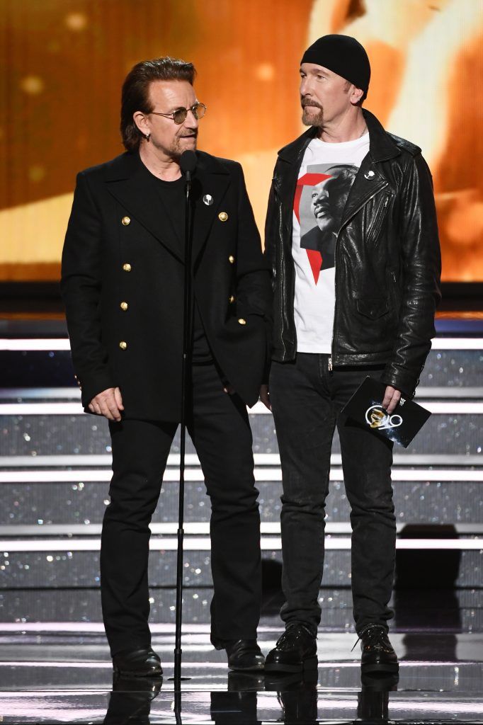 Recording artists Bono (L) and The Edge of music group U2 speak onstage during the 60th Annual GRAMMY Awards at Madison Square Garden on January 28, 2018 in New York City.  (Photo by Kevin Winter/Getty Images for NARAS)