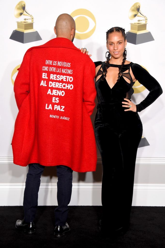Recording artists Swizz Beatz (L), fashion detail, and Alicia Keys pose in the press room during the 60th Annual GRAMMY Awards at Madison Square Garden on January 28, 2018 in New York City.  (Photo by Michael Loccisano/Getty Images for NARAS)