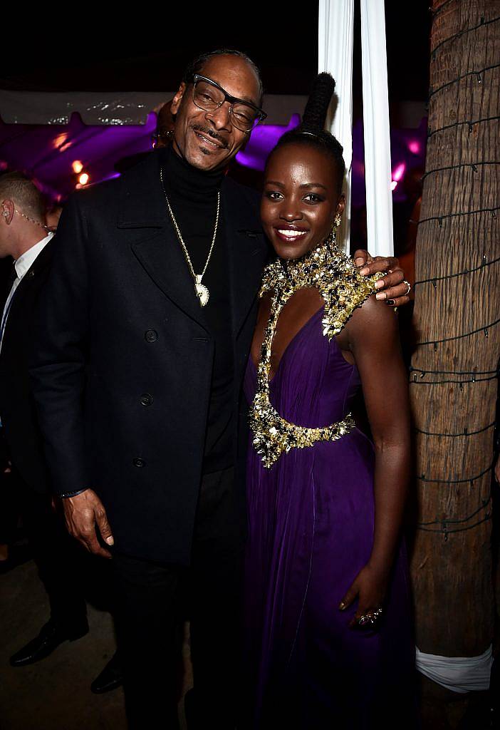 Rapper Snoop Dogg (L) and actor Lupita Nyong'o at the Los Angeles World Premiere of Marvel Studios' BLACK PANTHER at Dolby Theatre on January 29, 2018 in Hollywood, California.  (Photo by Alberto E. Rodriguez/Getty Images for Disney)