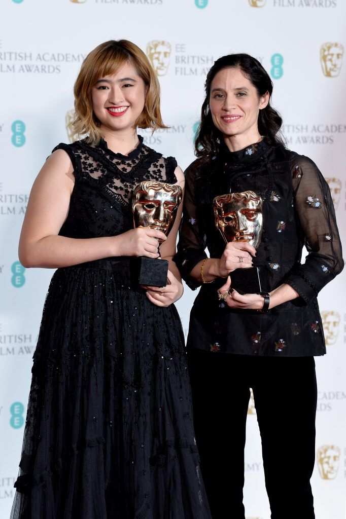 Ser En Low and Paloma Baeza, winners of the British Short Animation award for the movie "Poles Apart" pose in the press room during the EE British Academy Film Awards (BAFTA) held at Royal Albert Hall on February 18, 2018 in London, England.  (Photo by Jeff Spicer/Jeff Spicer/Getty Images)