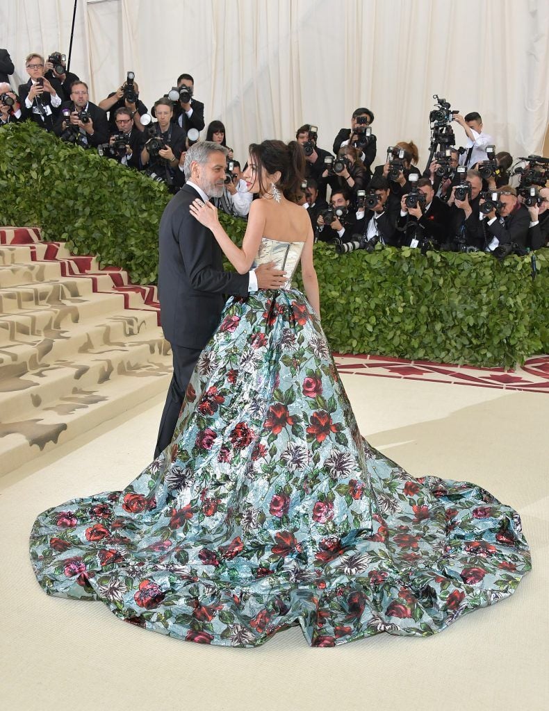 NEW YORK, NY - MAY 07:  George Clooney and Amal Clooney attend the Heavenly Bodies: Fashion & The Catholic Imagination Costume Institute Gala at The Metropolitan Museum of Art on May 7, 2018 in New York City.  (Photo by Neilson Barnard/Getty Images)