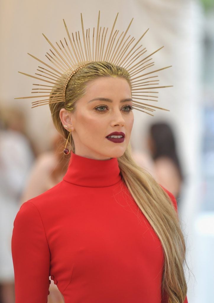NEW YORK, NY - MAY 07:  Amber Heard attends the Heavenly Bodies: Fashion & The Catholic Imagination Costume Institute Gala at The Metropolitan Museum of Art on May 7, 2018 in New York City.  (Photo by Neilson Barnard/Getty Images)