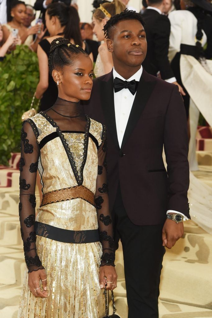 NEW YORK, NY - MAY 07:  Letitia Wright and John Boyega attend the Heavenly Bodies: Fashion & The Catholic Imagination Costume Institute Gala at The Metropolitan Museum of Art on May 7, 2018 in New York City.  (Photo by Jamie McCarthy/Getty Images)
