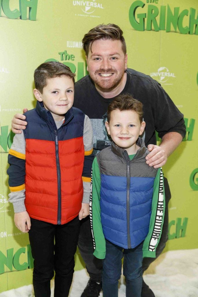 Thomas Cross with Sean (8) and Adam Lumley (6) pictured at the Irish premiere screening of The Grinch at ODEON Point Village, Dublin. Picture Andres Poveda