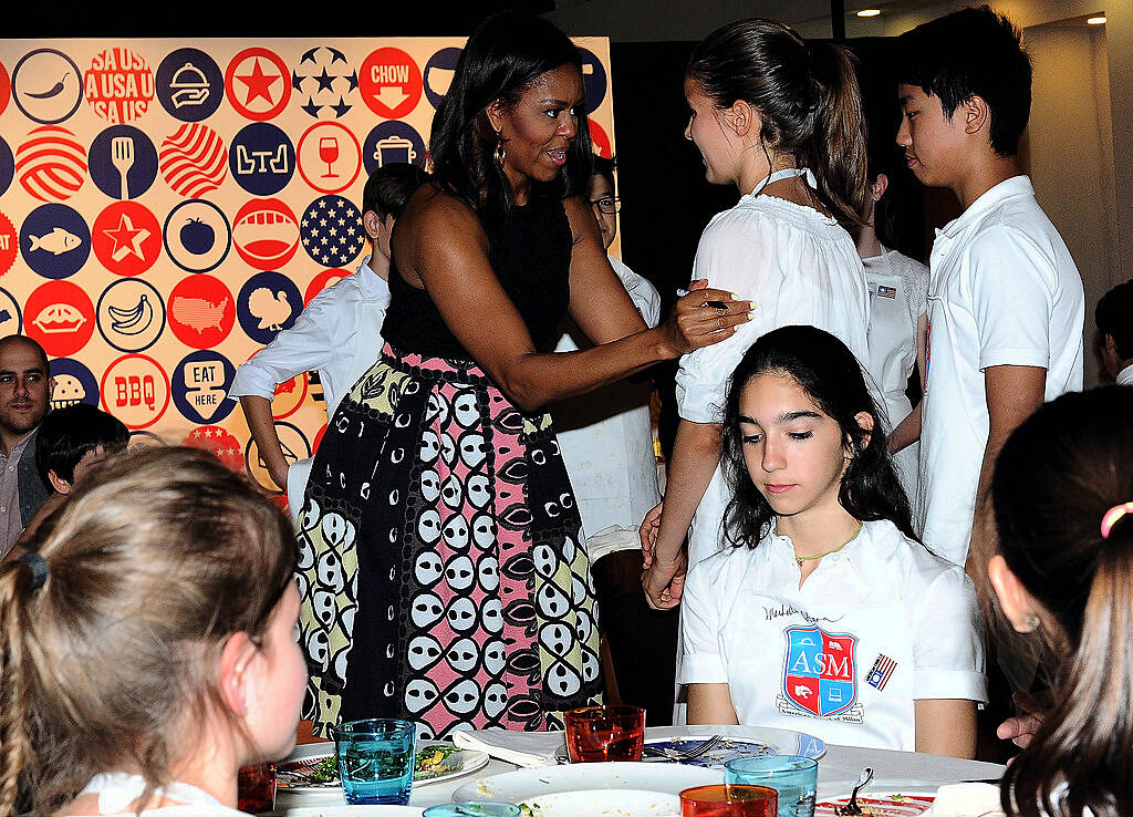 MILAN, ITALY - JUNE 17:  First Lady Michelle Obama hosts a cooking demonstration for local students at the James Beard American Restaurant on June 17, 2015 in Milan, Italy. After visiting London, Michelle Obama has travelled to Italy where she is expected to speak about her 'Let's Move' initiative to combat childhood obesity.   (Photo by Pier Marco Tacca/Getty Images)