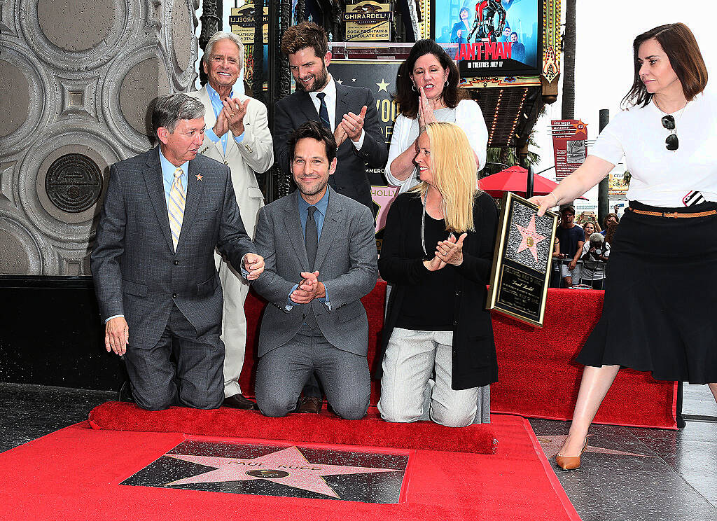 HOLLYWOOD, CA - JULY 01: (L-R) Leron Gubler, Emcee: Hollywood Chamber of Commerce, President/CEO, actor Paul Rudd, guest, producer Ana Martinez, (black row from left to right) actor Michael Douglas, actor Adam Scott, and a guest attend the ceremony honoring actor Paul Rudd with a Star on the Hollywood Walk of Fame on July 1, 2015 in Hollywood, California.  (Photo by Frederick M. Brown/Getty Images)