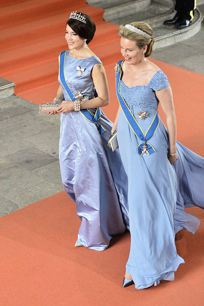 Queen Mathilde of Belgium (R) and Crown Princess Mary of Denmark leave after the wedding of Sweden's Crown Prince Carl Philip and Sofia Hellqvist at the Royal Chapel at Stockholm Palace on June 13, 2015.  AFP PHOTO / TT NEWS AGENCY / HENRIK MONTGOMERY +++ SWEDEN OUT        (Photo credit should read HENRIK MONTGOMERY/AFP/Getty Images)