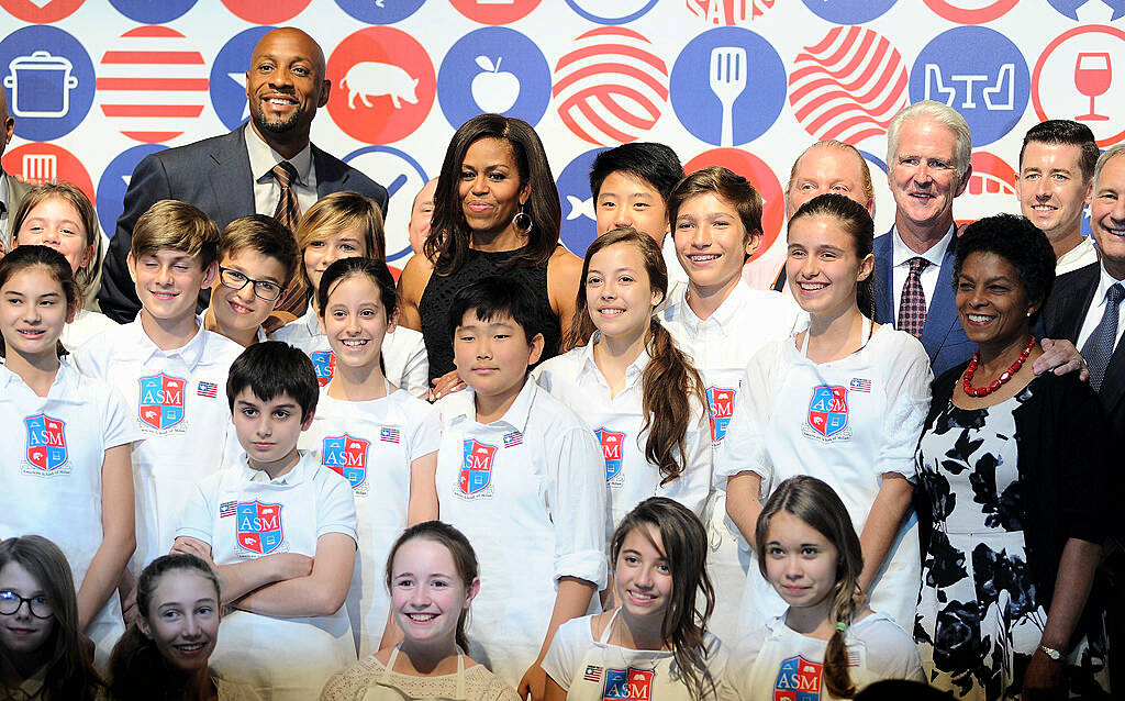 MILAN, ITALY - JUNE 17:  First Lady Michelle Obama hosts a cooking demonstration for local students at the James Beard American Restaurant on June 17, 2015 in Milan, Italy. After visiting London, Michelle Obama has travelled to Italy where she is expected to speak about her 'Let's Move' initiative to combat childhood obesity.  (Photo by Pier Marco Tacca/Getty Images)